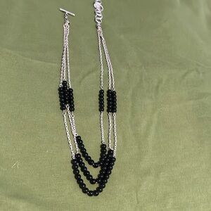 Silver necklace with black beads